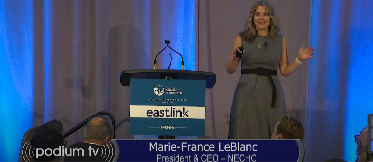 Marie-France LeBlanc speaks at a podium during a Podium-TV event, discussing The North End Community Health Centre's initiatives.
